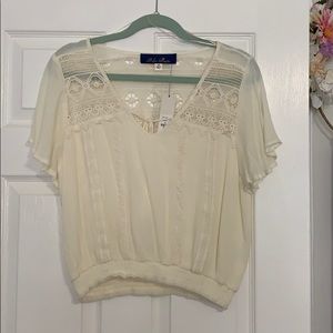 Cream Lacey short sleeved blouse